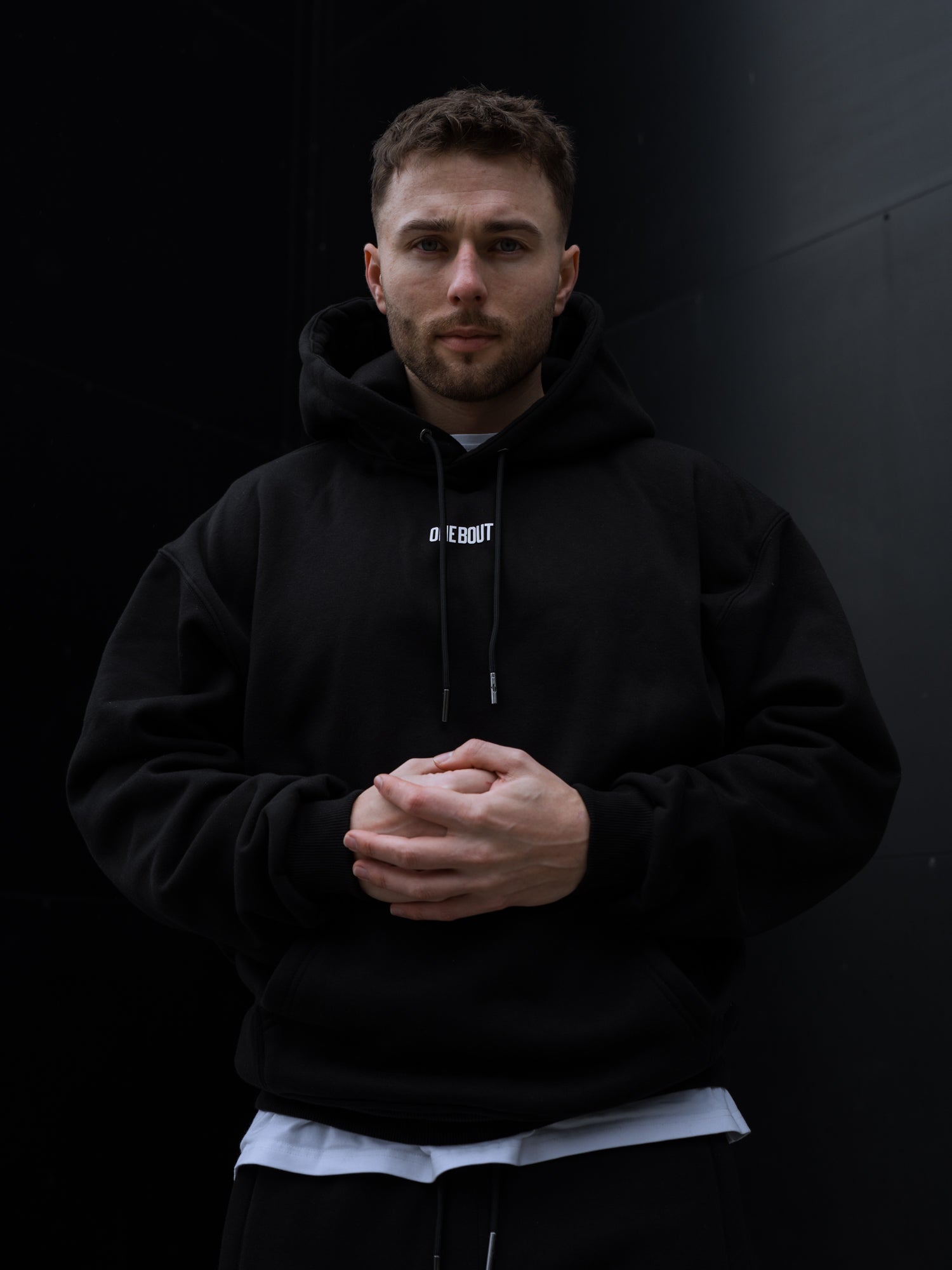 ONE BOUT Men's Script Oversized Hoodie in Black — close-up