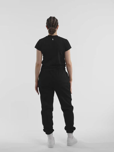 Female model in black ONE BOUT Script T-Shirt — fit and movement