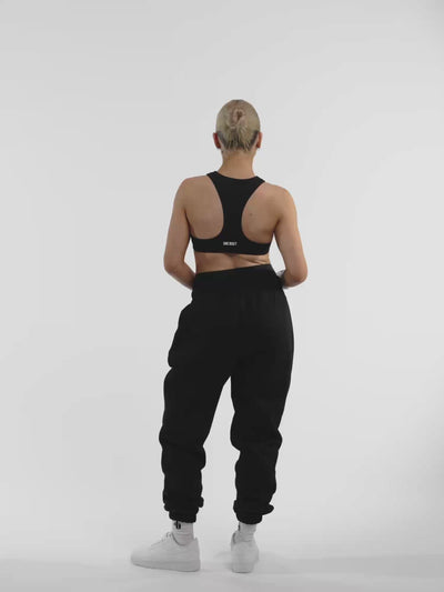 Female model in black ONE BOUT Script Bottoms — fit and movement