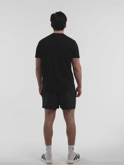 Male model in black ONE BOUT Line T-Shirt — fit and movement